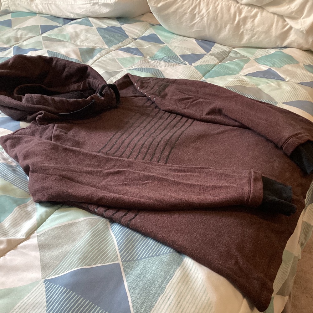 Under Armour ladies variegated wine colored hoodie with black trim and cuffs